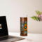 Take your custom tooled-leather style tumbler with you whether you are on the go, home, or at work. Tumbler sitting on a desk.